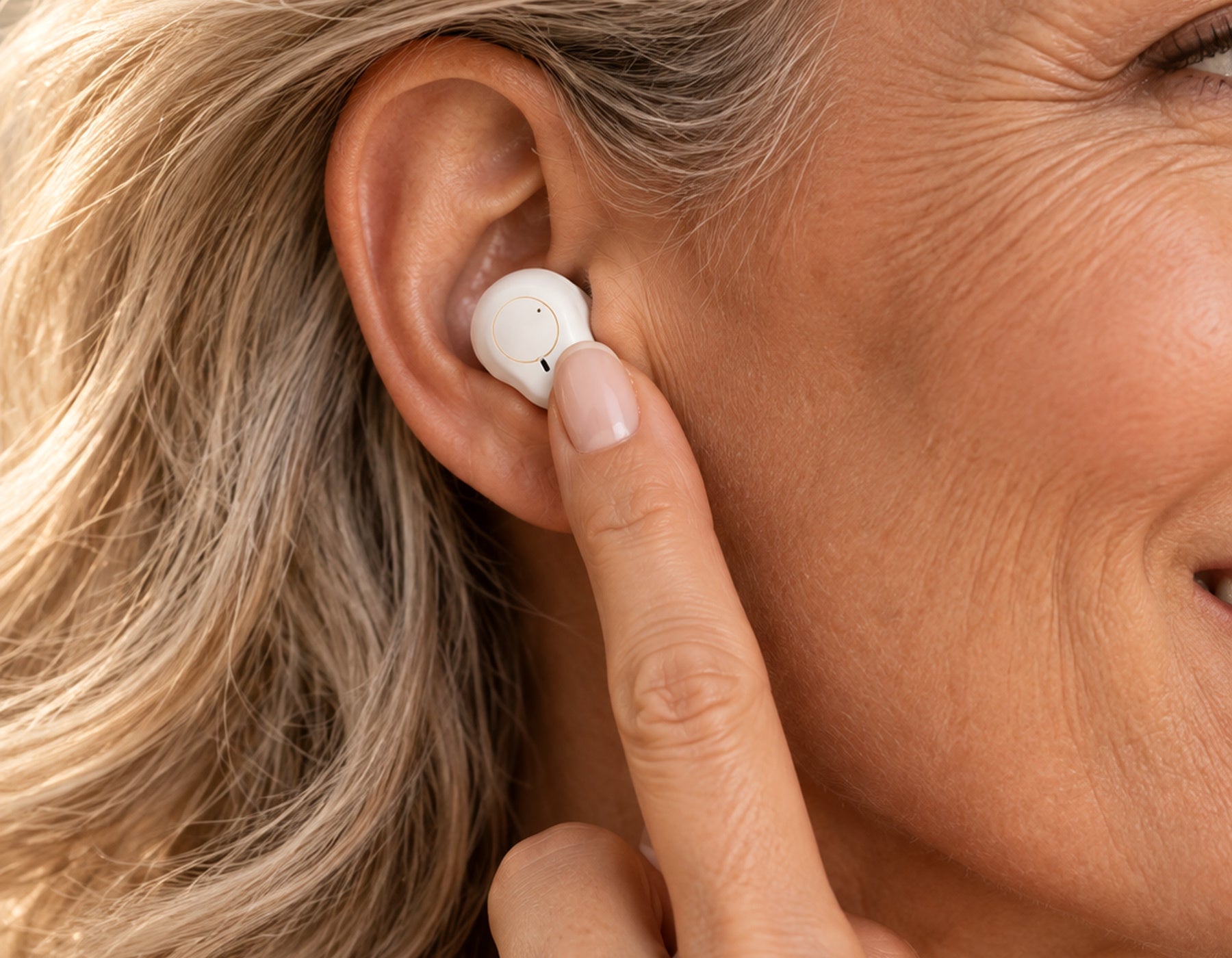 Tap hearing aid to adjust